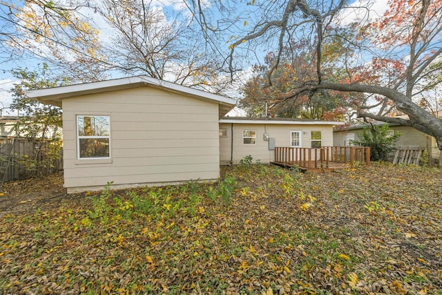 rear view of property featuring a deck