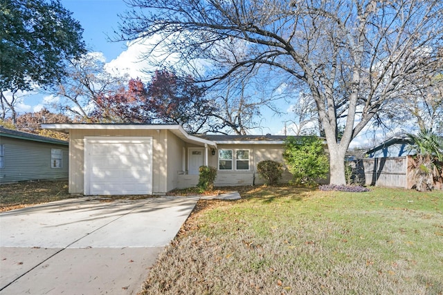 ranch-style house with a garage and a front lawn