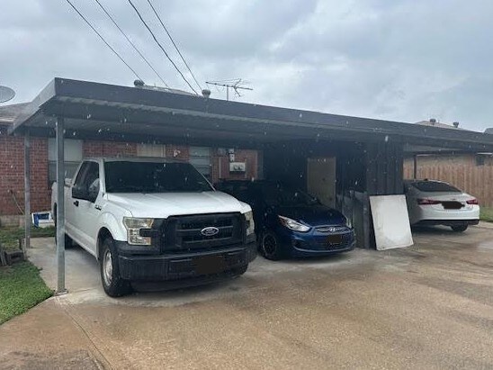 view of parking / parking lot with a carport