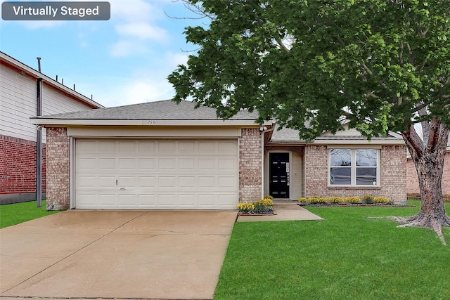 view of front of house featuring a garage and a front yard