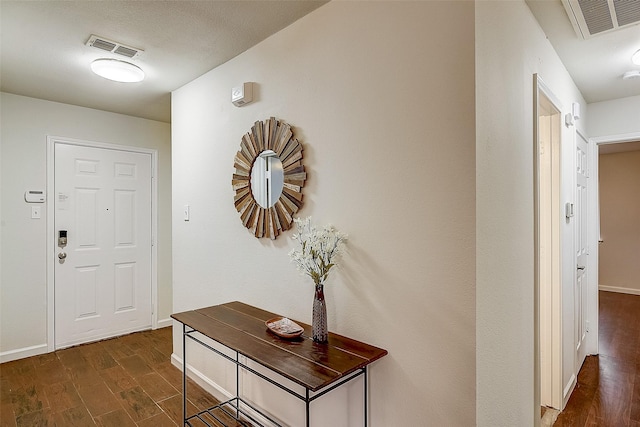 entrance foyer with dark hardwood / wood-style floors