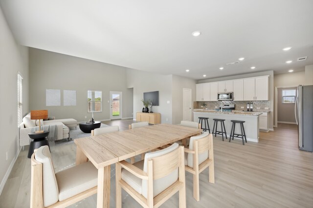 dining room featuring light hardwood / wood-style flooring