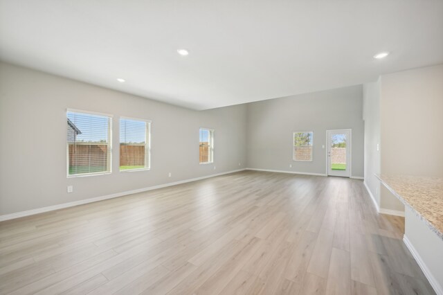 unfurnished living room featuring light hardwood / wood-style flooring