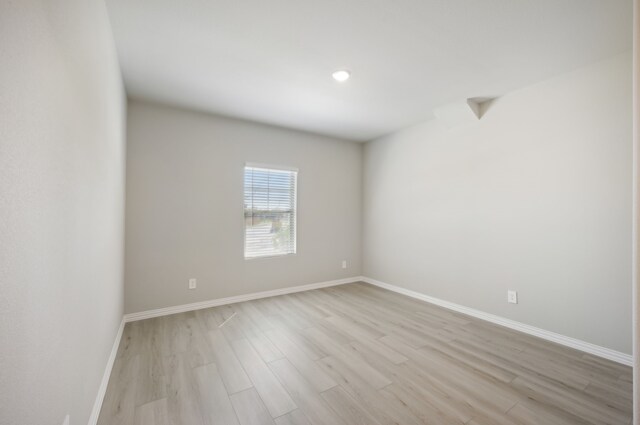 unfurnished room featuring light wood-type flooring