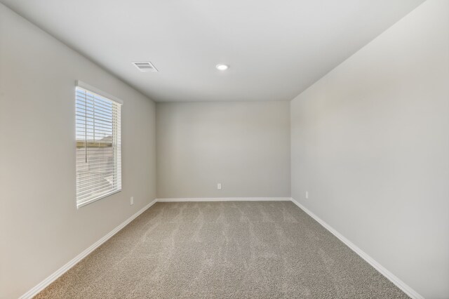 empty room featuring carpet floors