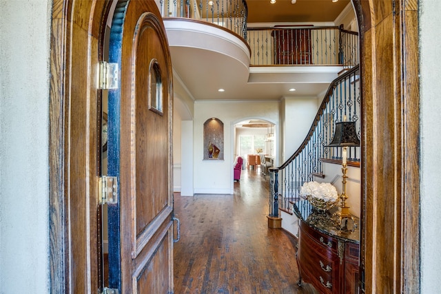 foyer featuring dark hardwood / wood-style flooring and ornamental molding