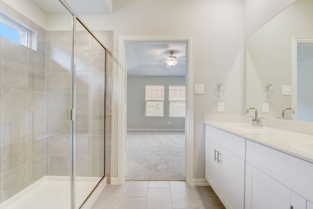 full bathroom featuring tiled shower / bath, vanity, and toilet