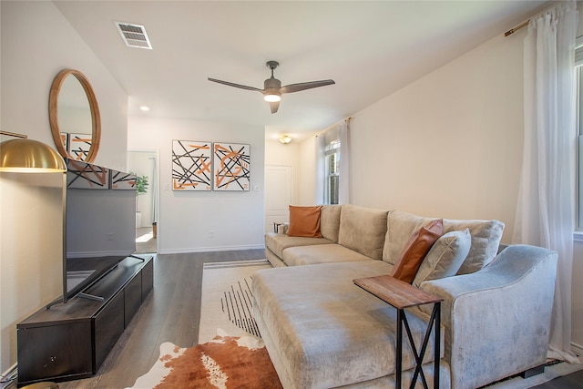 living room featuring hardwood / wood-style flooring and ceiling fan