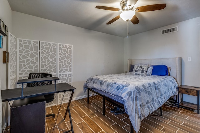 bedroom featuring ceiling fan and hardwood / wood-style floors