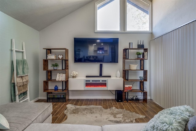 living room featuring dark hardwood / wood-style flooring and high vaulted ceiling