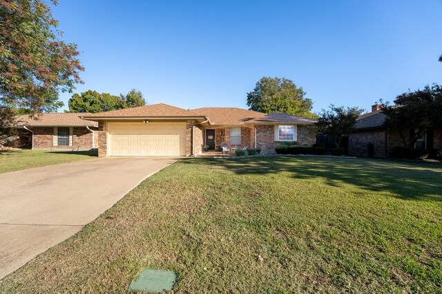 ranch-style house with a front lawn and a garage