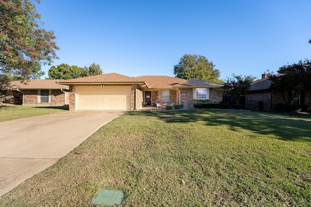 ranch-style house with a garage and a front lawn