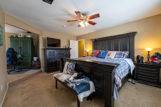 carpeted bedroom featuring ceiling fan