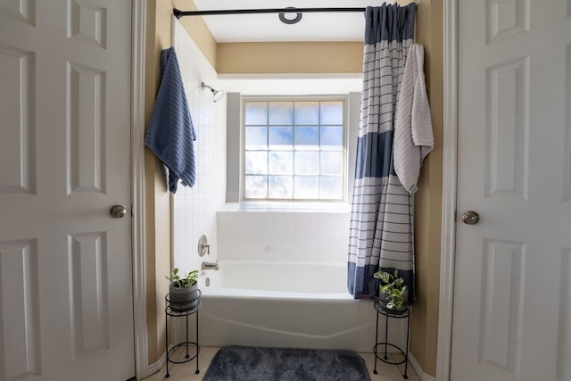 bathroom with shower / bath combination with curtain