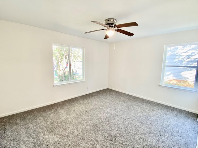 unfurnished room featuring ceiling fan and carpet flooring