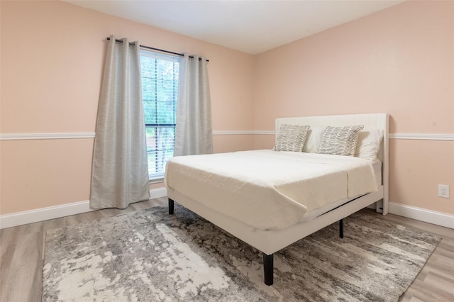 bedroom featuring wood-type flooring