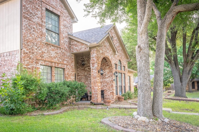 property entrance with a yard