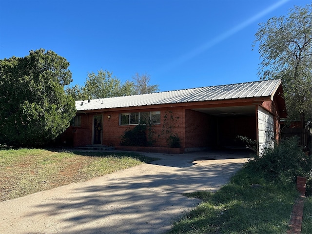 view of front of house with a carport