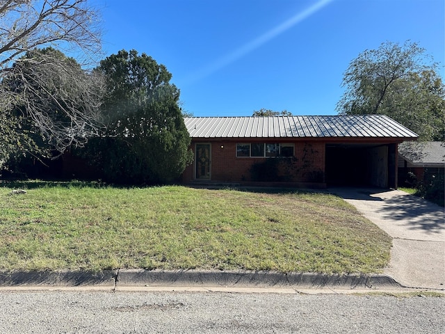 ranch-style house with a front yard and a carport