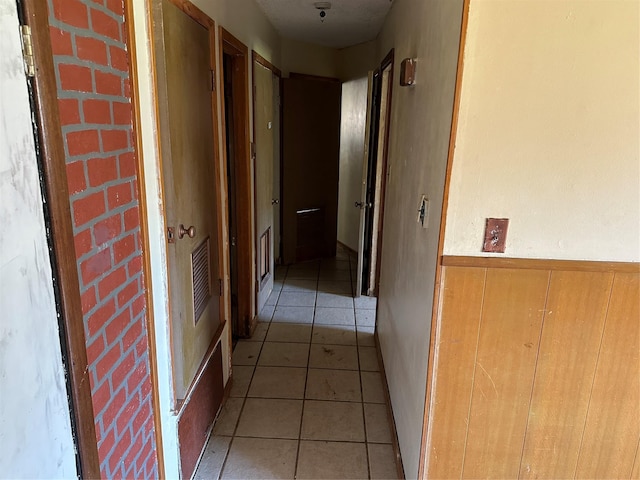 corridor with light tile patterned flooring