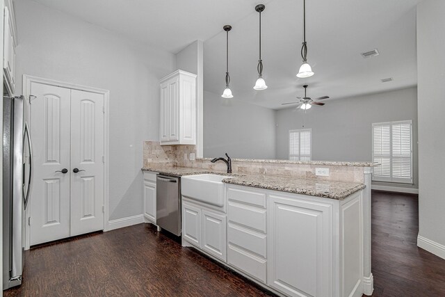 home office with high vaulted ceiling, dark hardwood / wood-style floors, ceiling fan, and a wealth of natural light