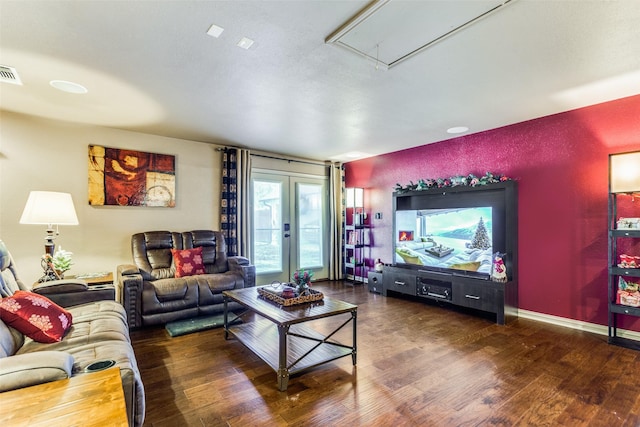 living room featuring dark hardwood / wood-style flooring and french doors