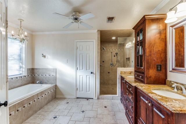 bathroom featuring vanity, ornamental molding, ceiling fan with notable chandelier, and independent shower and bath