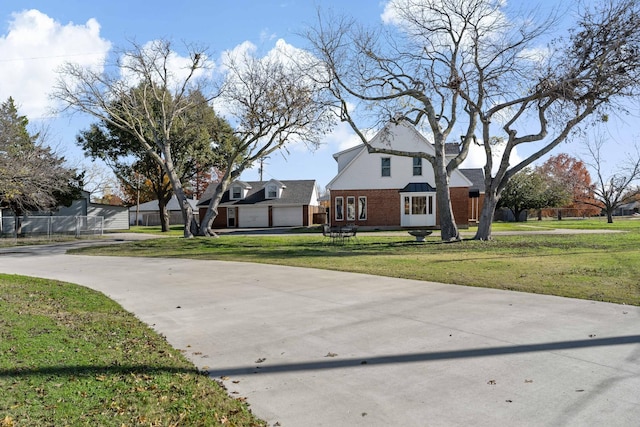 exterior space featuring a front yard and a garage