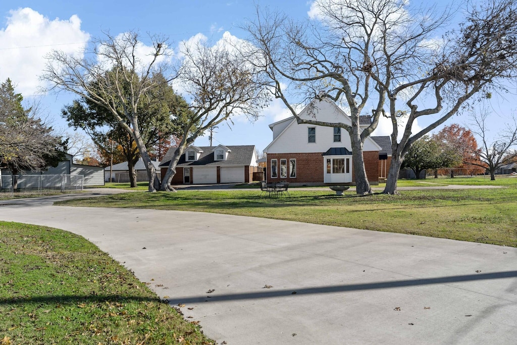 exterior space with a garage and a front yard