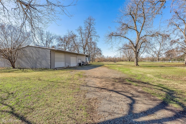 80 River Walk Dr, Bossier City, LA 71111 - view of side of property with an outdoor structure and a garage