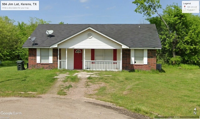 view of front of house with covered porch and a front lawn