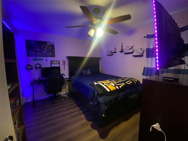 bedroom featuring hardwood / wood-style flooring and ceiling fan