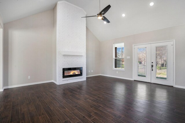 living room with a fireplace, dark hardwood / wood-style flooring, high vaulted ceiling, and ceiling fan