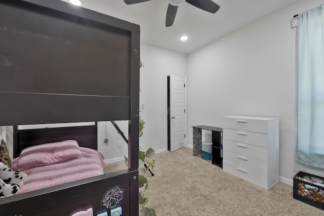 bedroom featuring light colored carpet and ceiling fan