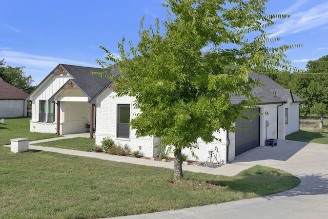 modern inspired farmhouse featuring a front yard and a garage