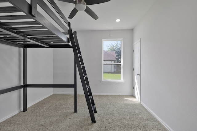 stairway featuring carpet flooring