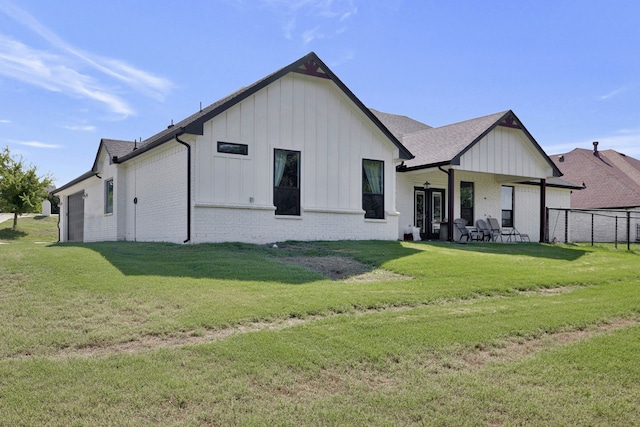 back of house with a yard