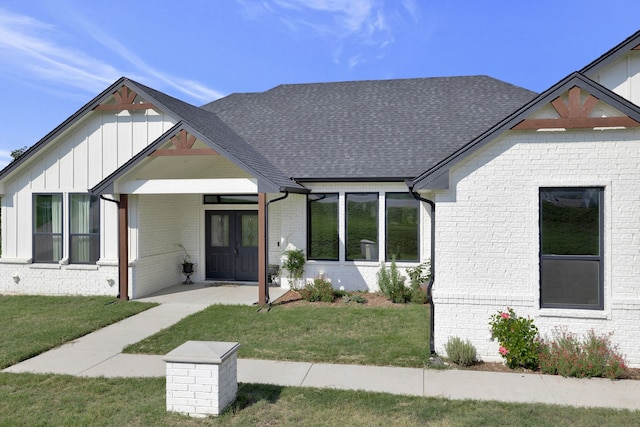 5564 Sheilagh Pl, Fort Worth, TX 76126 - modern inspired farmhouse featuring brick siding, a front lawn, a shingled roof, and board and batten siding
