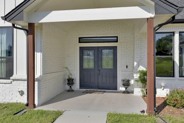 property entrance featuring covered porch