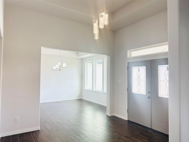 5564 Sheilagh Pl, Fort Worth, TX 76126 - entryway featuring a chandelier, dark wood-type flooring, and baseboards