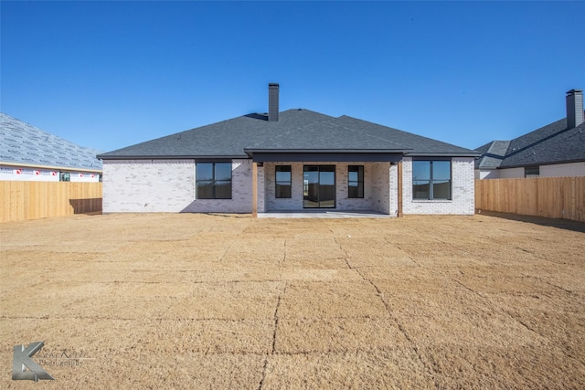 rear view of house with a patio