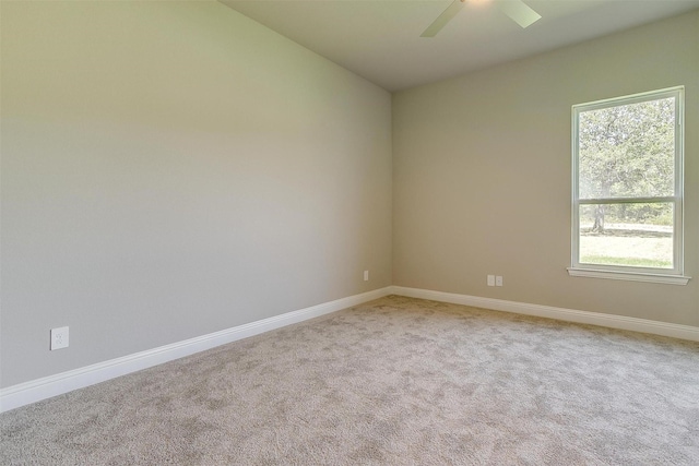 unfurnished room with ceiling fan and carpet floors