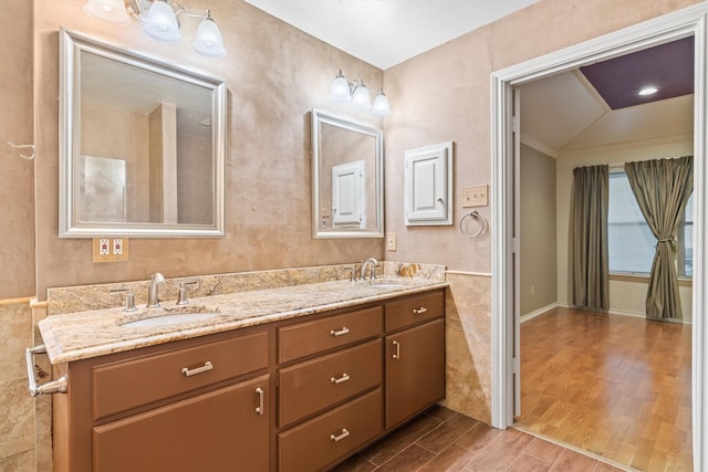 bathroom with hardwood / wood-style floors and vanity