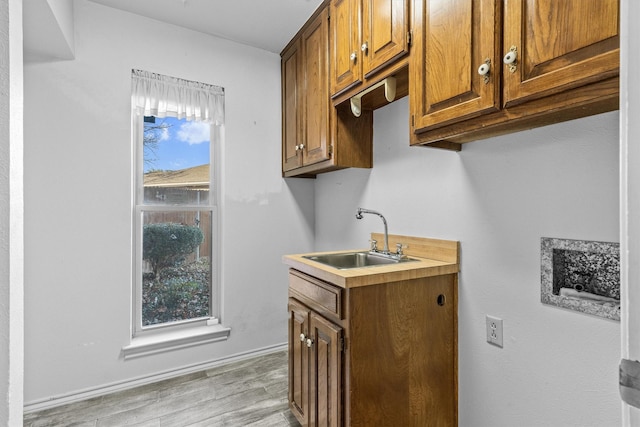 kitchen with sink and light wood-type flooring