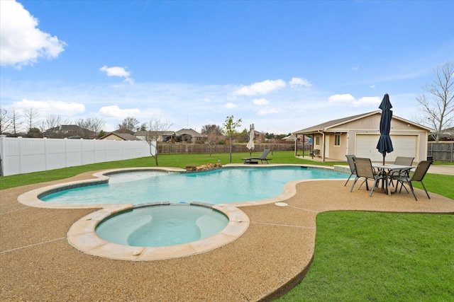 view of pool featuring a lawn, a patio area, and an in ground hot tub