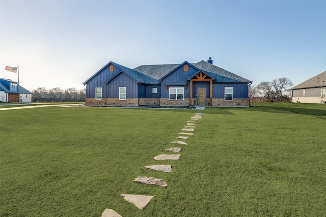 5223 Fox Trot Ln, Caddo Mills, TX 75135 - view of front of house featuring board and batten siding, a front lawn, and a chimney