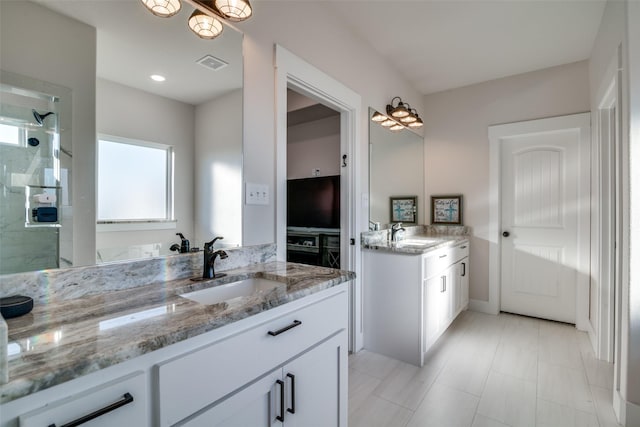 bathroom with vanity and walk in shower