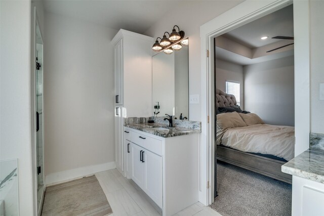 bathroom with ceiling fan and vanity