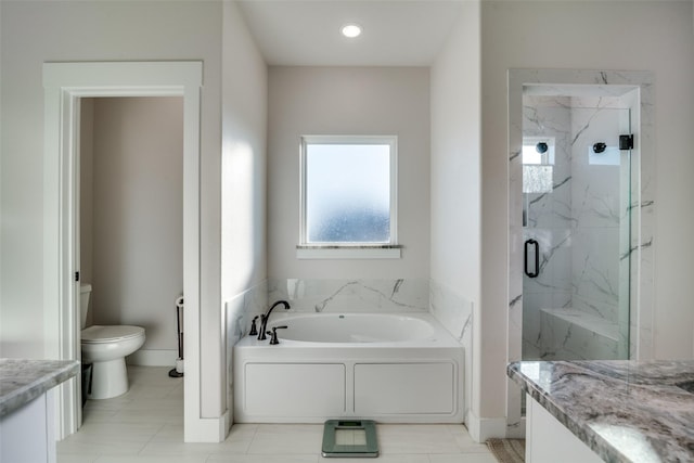 full bathroom featuring tile patterned floors, vanity, toilet, and separate shower and tub