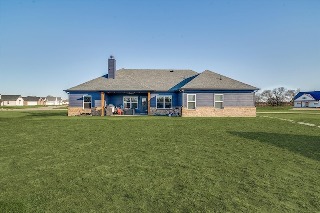 5223 Fox Trot Ln, Caddo Mills, TX 75135 - rear view of house featuring a chimney, roof with shingles, and a yard